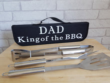 Load image into Gallery viewer, A black 3 piece BBQ tool set. Black canvas carry case with Dad, King of the BBQ in white across the front.