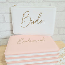 Load image into Gallery viewer, Flat textured leather look bag with gold zip and wrist strap.