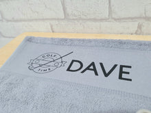 Load image into Gallery viewer, light grey turkish cotton gold towel with a metal hook in the corner. Personalised with the name of your choice.