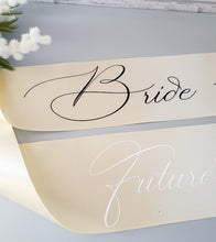 Load image into Gallery viewer, Champagne colour satin sash with zigzag trim. Bride to be written in cursive text