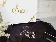 Load image into Gallery viewer, Black satin short sleeves pyjamas with white text on the back.