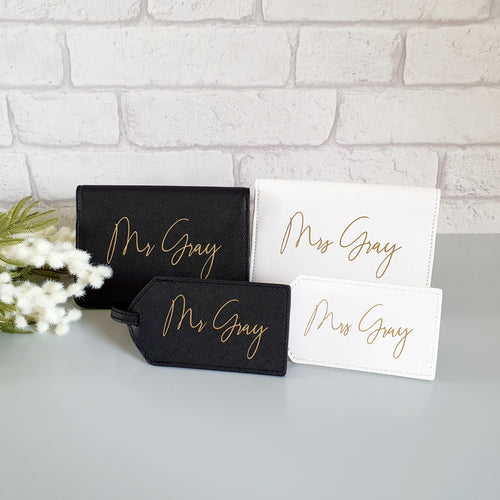 White and Black passport covers and luggage labels personalised with a surname in gold. 