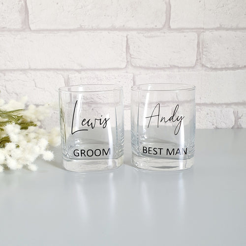 square whisky glasses personalised with a name and wedding role in black. 