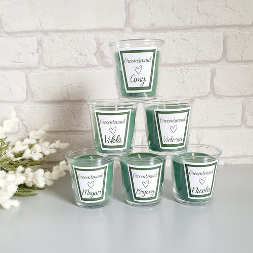 Green scented candle in a glass jar. Personalised with a name and wedding role. 