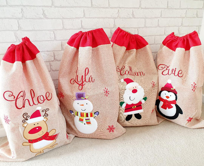 large hessian sack with a red draw string top. Decorated with either a reindeer, snowman, Santa or penguin and any name in red glitter text. 